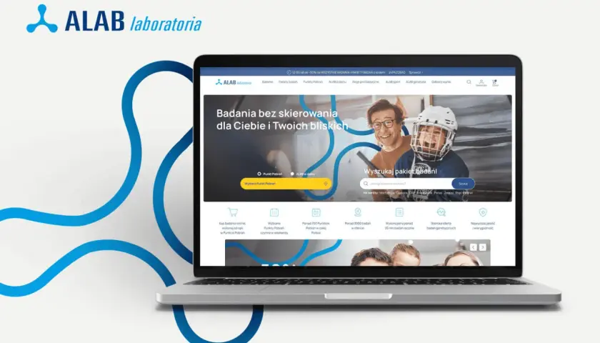 Laptop z otwartą stroną internetową ALAB Laboratoria, prezentującą ofertę badań i wyszukiwarkę pakietów.