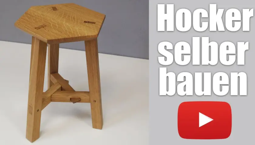 Ein sechseckiger Holzhocker mit drei Beinen, der zeigt, wie man einen dreibein holz selber bauen kann.