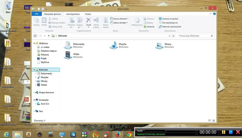 Gdzie jest panel sterowania w laptopie? Widok folderu "Biblioteki" z ikonami Dokumenty, Muzyka, Obrazy i Wideo.