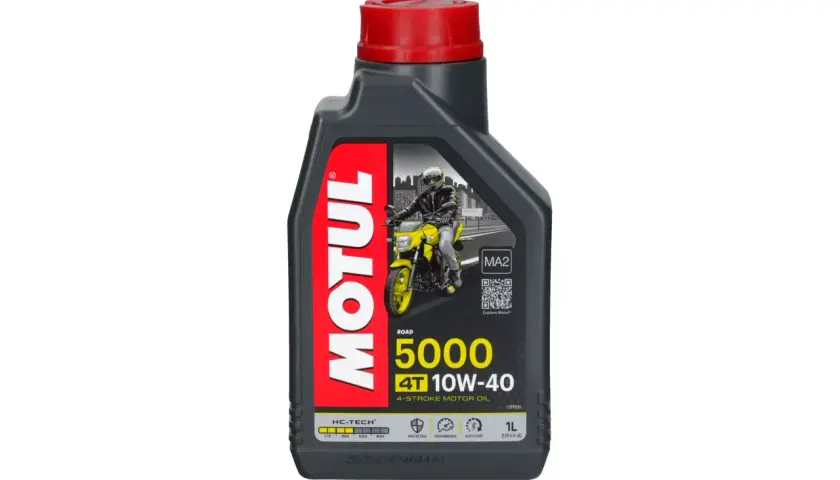 Butelka oleju Motul 5000 10W-40 z motocyklistą na etykiecie.