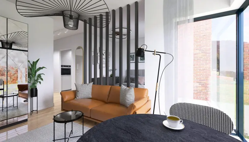 Nowoczesny salon z brązową kanapą i stolikami. W tle kuchnia i sypialnia. Projekt rafin developer.