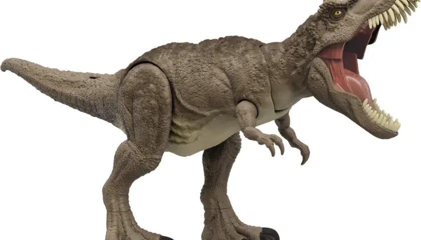 Zabawka T-Rex z otwartą paszczą i ostrymi zębami na białym tle.