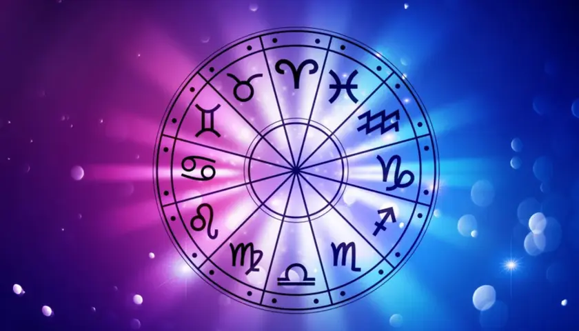 Koło zodiaku z symbolami, w tym Byk i Skorpion, na tle gradientu fioletowo-niebieskiego z rozmazanymi światłami.