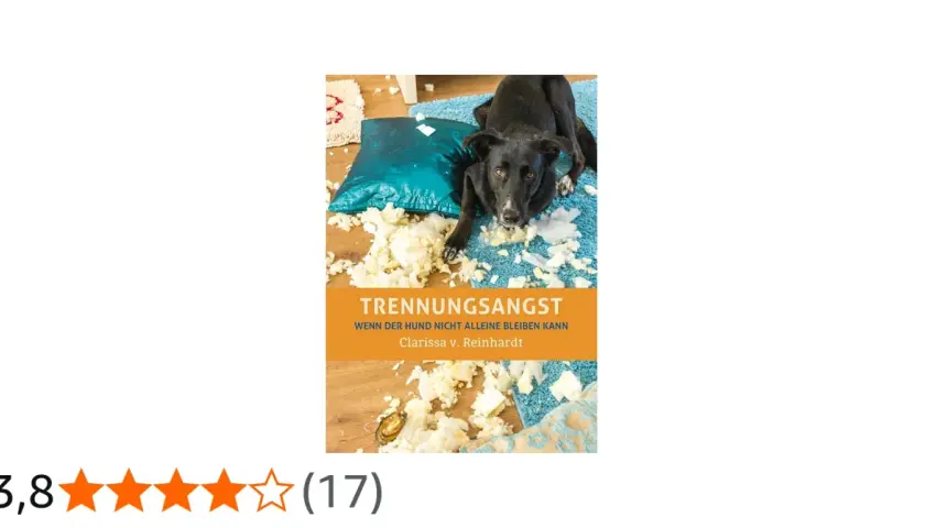Ein Hund hat ein Kissen zerlegt. Der Titel "Trennungsangst" und der Untertitel "Wenn der Hund nicht alleine bleiben kann" deuten auf ein Buch eines Hundetrainers hin.