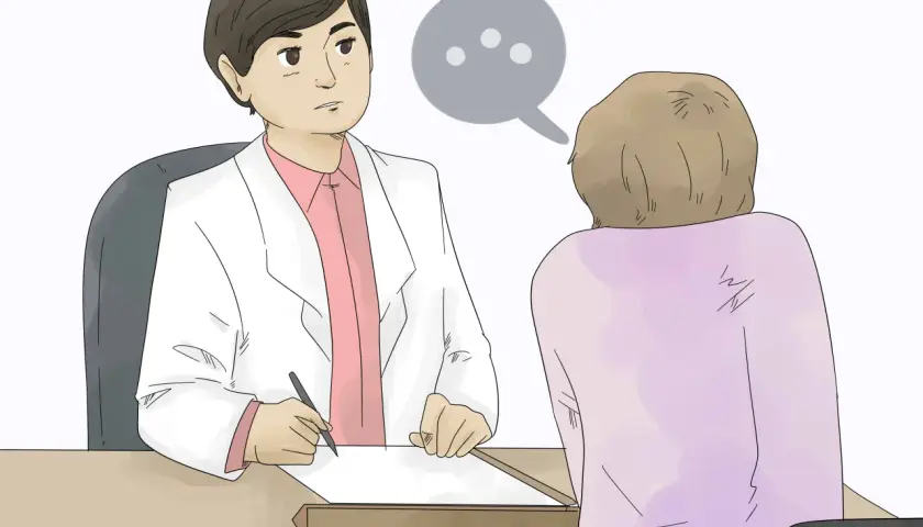 Medico ascolta paziente. Conversazione su come capire se un figlio è gay.