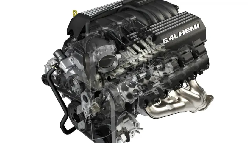 Silnik 6.4L HEMI, serce potężnego Hellcata, ukazany w przekroju, z widocznymi elementami układu rozrządu i dolotowego.