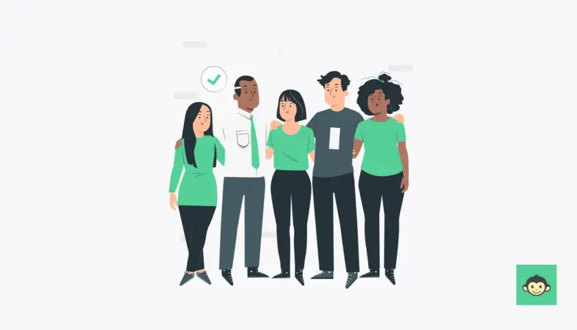 A diverse group of five friends stands together, arms around each other, showing what it means to value diversity.