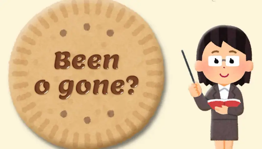 Biscotto con "Been o gone?" scritto in cioccolato, con una maestra che indica. Esempi di "been" e "gone" per imparare l'inglese.
