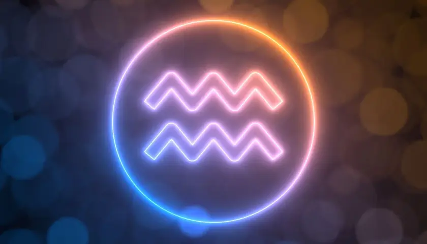 Neonowy symbol Wodnika, znaku zodiaku dla osób urodzonych 6 lutego, otoczony poświatą.