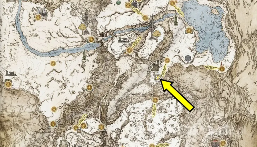 Mapa Elden Ring: Popioły Wojny. Żółta strzałka wskazuje drogę do lokacji w śnieżnych górach.
