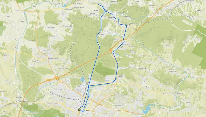 Mapa z zaznaczonymi ścieżkami rowerowymi w okolicach Kielc, prowadzącymi przez tereny zielone i miejscowości.