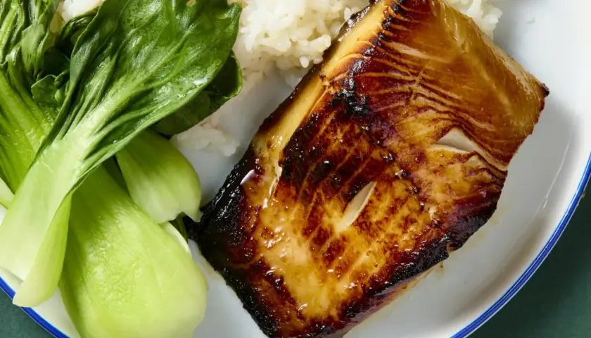 A perfectly seared miso cod recipe served with fluffy white rice and vibrant green bok choy.