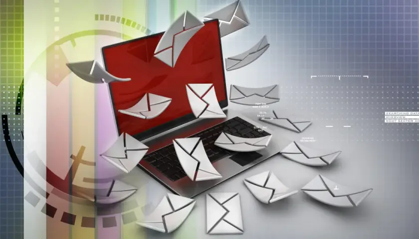 Un portátil rodeado de sobres digitales, como si se preguntara qué es Poe y cómo gestionar tantos correos.
