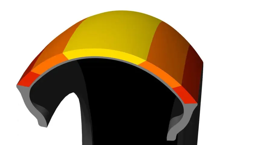 Corte transversal de un neumático con capas de colores, mostrando la tecnología que inspira las **Bridgestone S21 opiniones**.