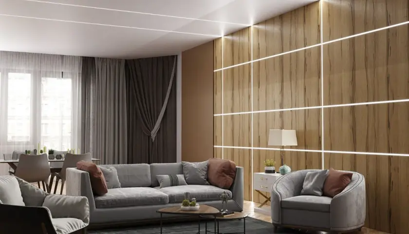 Nowoczesny salon z oświetleniem LED na suficie i drewnianej ścianie. Dowiedz się, jak zamontować ledy w pokoju, by uzyskać taki efekt.