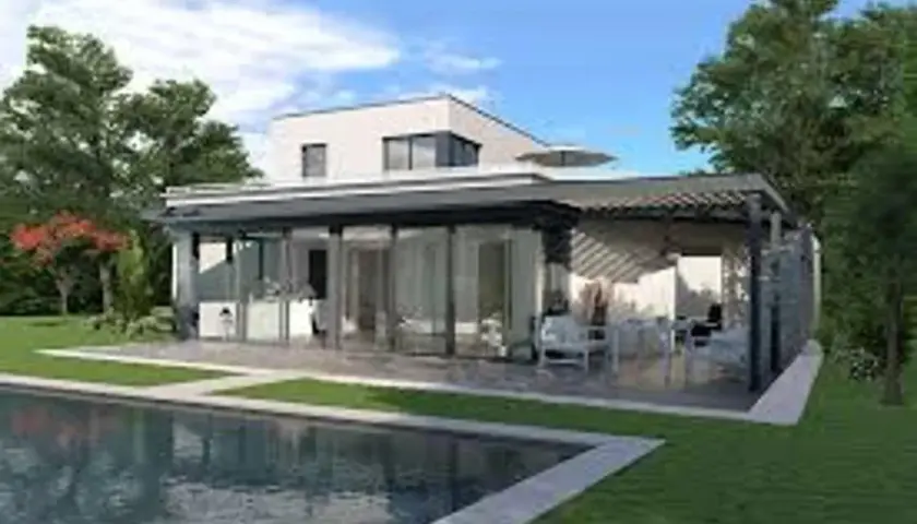 Maison moderne avec piscine et véranda. La décoration véranda extérieur invite à la détente avec ses meubles confortables et son ambiance lumineuse.