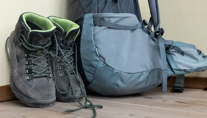 Hiking boots and backpack ready for adventure. Learn the best way to clean hiking boots to keep them in top condition for your next trek.