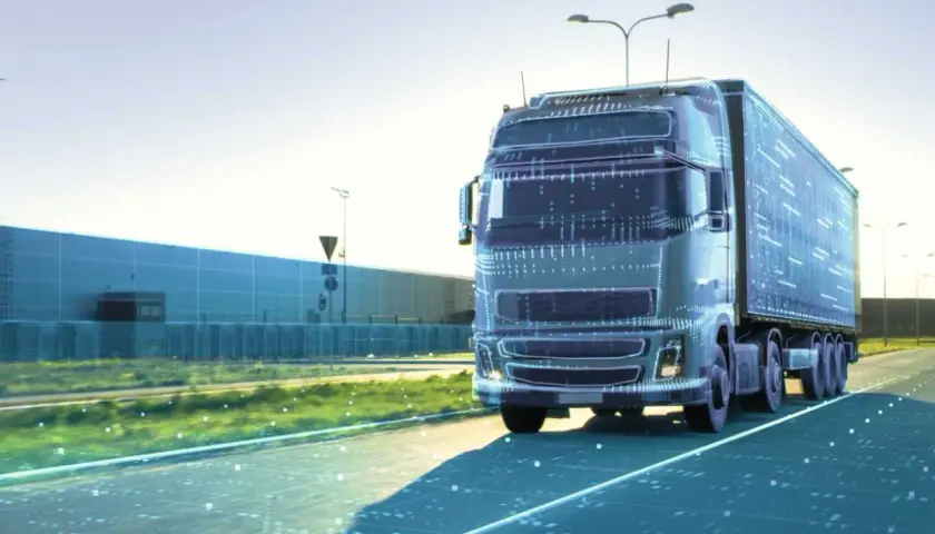 Ein futuristischer LKW fährt auf einer Straße, die von digitalen Daten durchzogen ist. Dies symbolisiert die Zukunft der Logistik und autonome Transportsysteme.