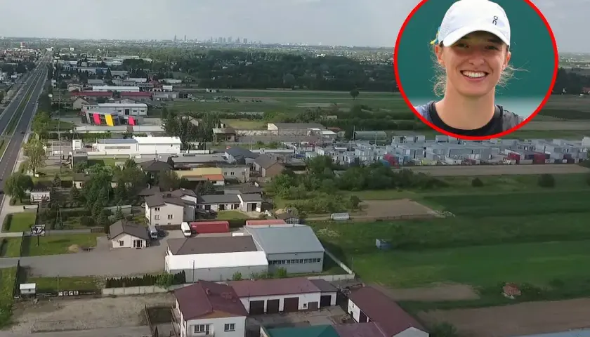 Iga Świątek w okręgu na tle krajobrazu z zabudowaniami i panoramą miasta.