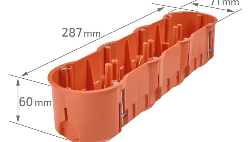 Pomarańczowa puszka elektryczna o wymiarach 287x71x60 mm, z widocznymi elementami montażowymi.