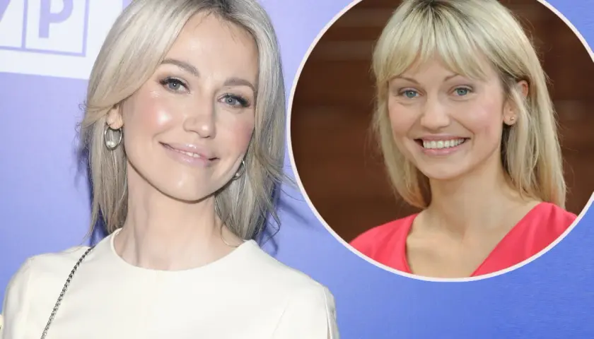 Magdalena Ogórek w białej sukience i w różowej bluzce, uśmiechnięta.