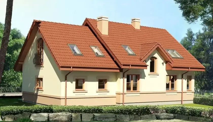 Uroczy dom Karmelita Gold 2m z czerwoną dachówką i balkonem, otoczony zielenią.