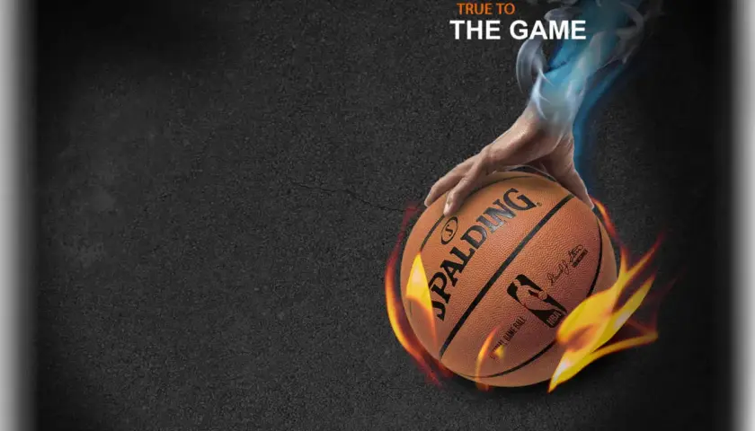 Dłoń trzyma piłkę Spalding TF-500, otoczoną płomieniami i niebieską mgłą. Napis "TRUE TO THE GAME".