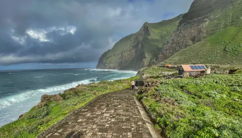 A scenic walk along the coast of Madeira, with dramatic cliffs and crashing waves. This view captures the essence of a week in Madeira.