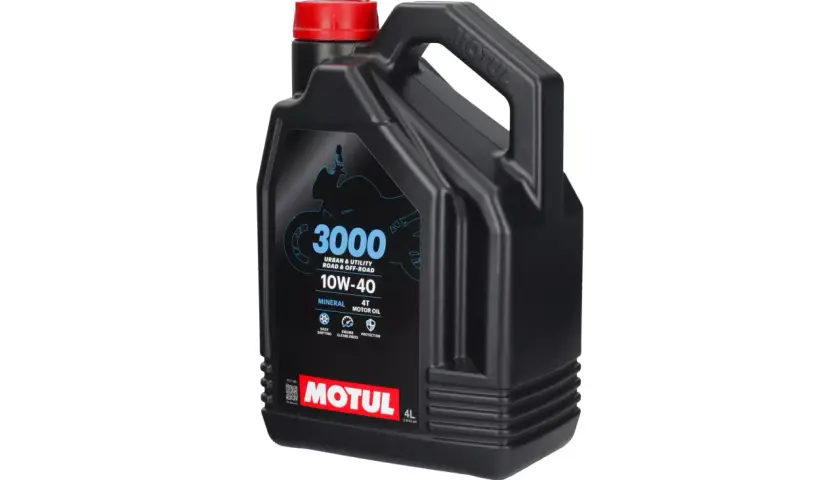 Czarna, plastikowa bańka oleju silnikowego Motul 3000 10W-40 z czerwoną zakrętką.