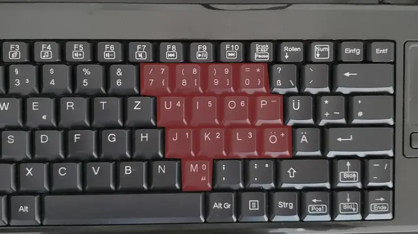 Die Tastatur zeigt, dass die Zahlenreihe und die Tasten mit den Zahlen 1-6 rot markiert sind. Die Tastatur zahlen gehen nicht.