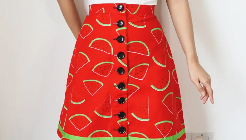 A-line skirt with a fun watermelon print, featuring black buttons down the front. Get this printable a line skirt pattern free and sew your own summer style!