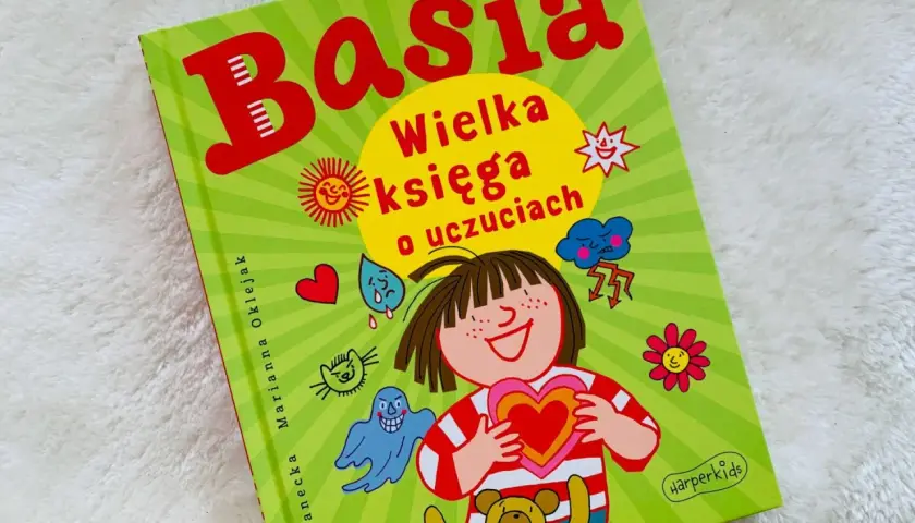 Okładka książki "Basia. Wielka księga o uczuciach" z ilustracjami przedstawiającymi różne emocje i postacie.