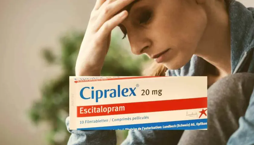 Donna con mal di testa tiene in mano una scatola di Cipralex, farmaco che serve per trattare depressione e ansia.