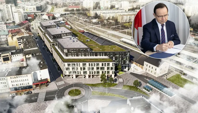 Nowoczesny dworzec autobusowy Rzeszów z zielonymi dachami i otaczającą infrastrukturą. W tle mężczyzna w garniturze podpisuje dokument.