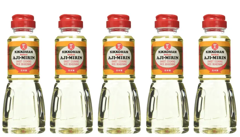 Five bottles of Kikkoman Aji-Mirin, a sweet cooking rice seasoning. Mirin is used to add sweetness and glaze to Japanese dishes.