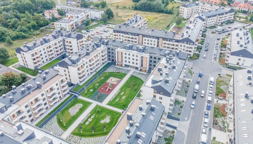 Nowoczesne osiedle z placem zabaw i zielenią, idealne na rodzinne maślice.