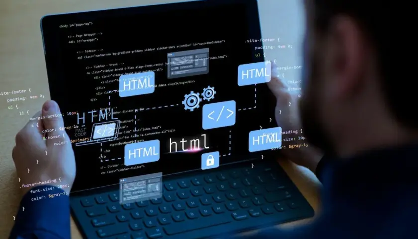 Kodowanie strony internetowej z użyciem semantyczny html. Widok kodu i schemat blokowy na tablecie.