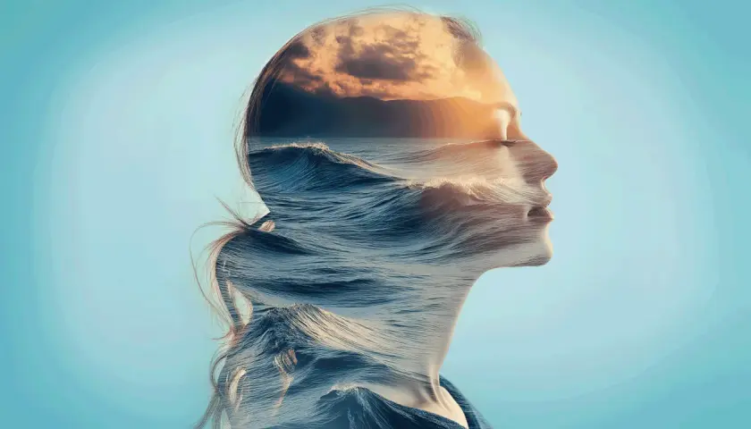 Onda di mare e cielo al tramonto si fondono nel profilo di una donna, un'immagine che evoca il sentimento di quando mi viene l'ansia senza motivo.
