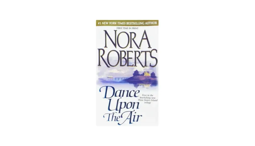 Nora Roberts' "Dance Upon The Air" – ein Buchcover mit einer malerischen Insel, die wie eine Insel der Sehnsucht wirkt. Ein Haus und ein Steg sind zu sehen.