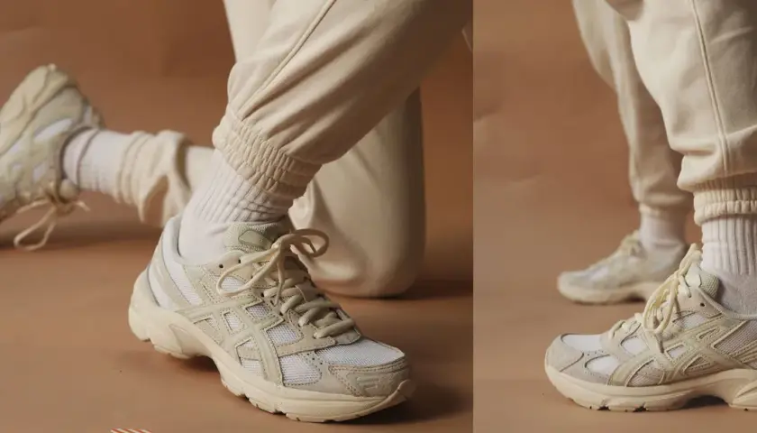 Zapatillas deportivas en color beige claro, combinadas con pantalones y calcetines del mismo tono.