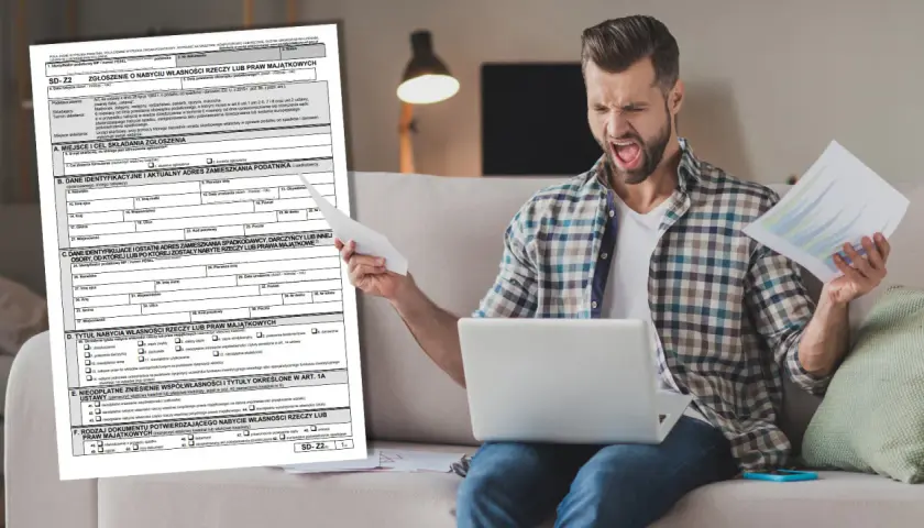 Frustracja przy wypełnianiu druku SD-Z2. Mężczyzna z laptopem i dokumentami wygląda na przytłoczonego.