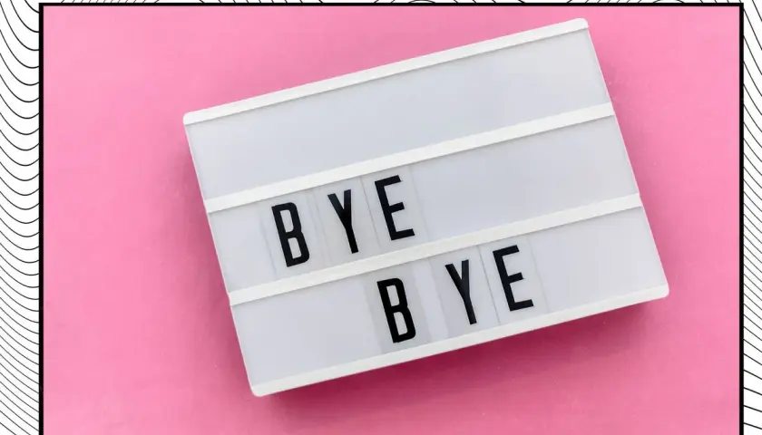 Letrero luminoso con "BYE BYE" sobre fondo rosa, ideal para frases para despedir el año con estilo.