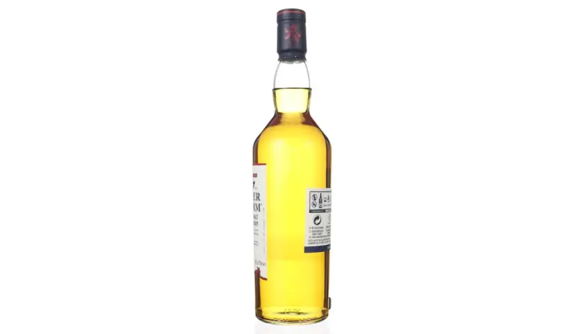 Bouteille de whisky Talisker Dark Storm, ambré, avec étiquette blanche et rouge. Le bouchon est bleu marine avec un lion rouge.