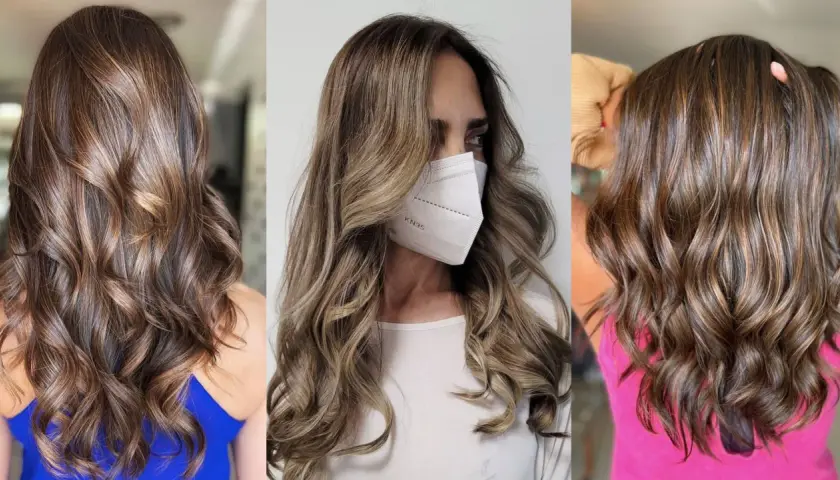 Cabello castaño con mechas mousy hair, ondas suaves y brillo natural.