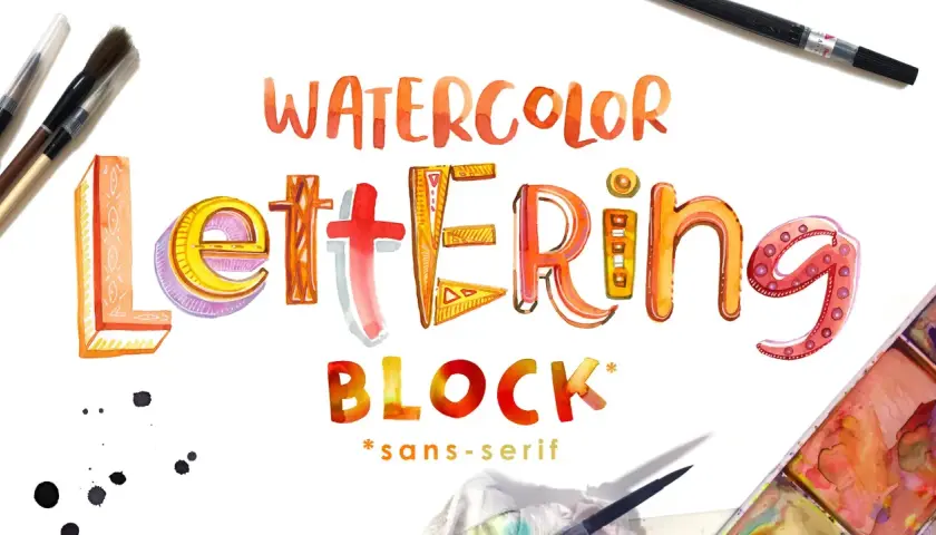 Letras de acuarela vibrantes y detalladas forman "WATERCOLOR LETTERING BLOCK". Pinceles y acuarelas sugieren el proceso creativo.
