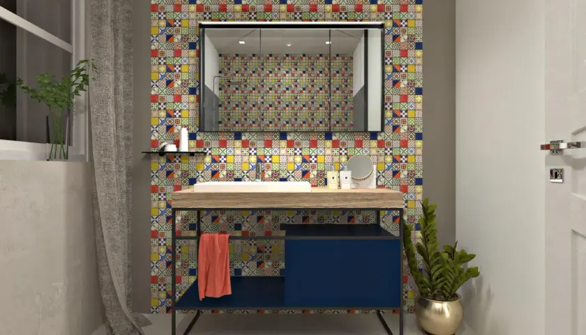 Un bagno moderno con un lavabo su un mobile blu scuro, incorniciato da un vivace **boxer mosaico** che riveste la parete.