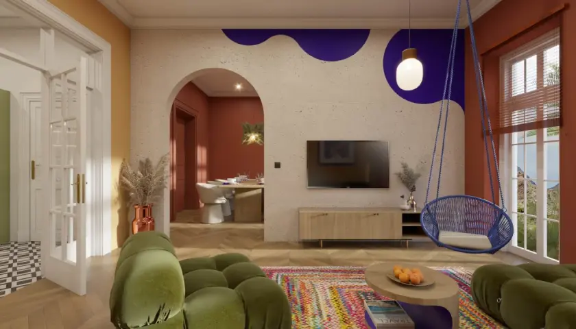 Nowoczesny salon z huśtawką, zieloną sofą i kolorowym dywanem.
