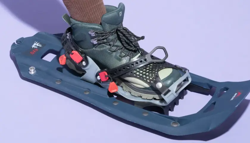 A boot is attached to a snowshoe. You do not need special boots for snowshoes; hiking boots work well.