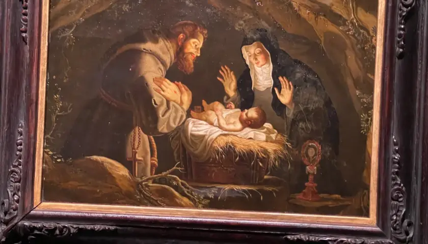 Święty Franciszek i święta Klara adorują Dzieciątko Jezus. Obraz oddaje ducha franciszkanizmu poprzez prostotę i pokorę sceny.
