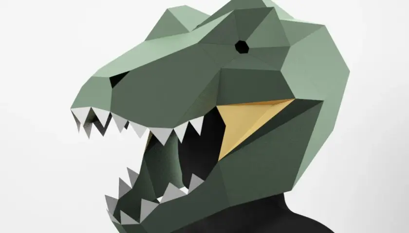 Maschera dinosauro fai da te, con denti aguzzi e bocca aperta, pronta per un'avventura preistorica.